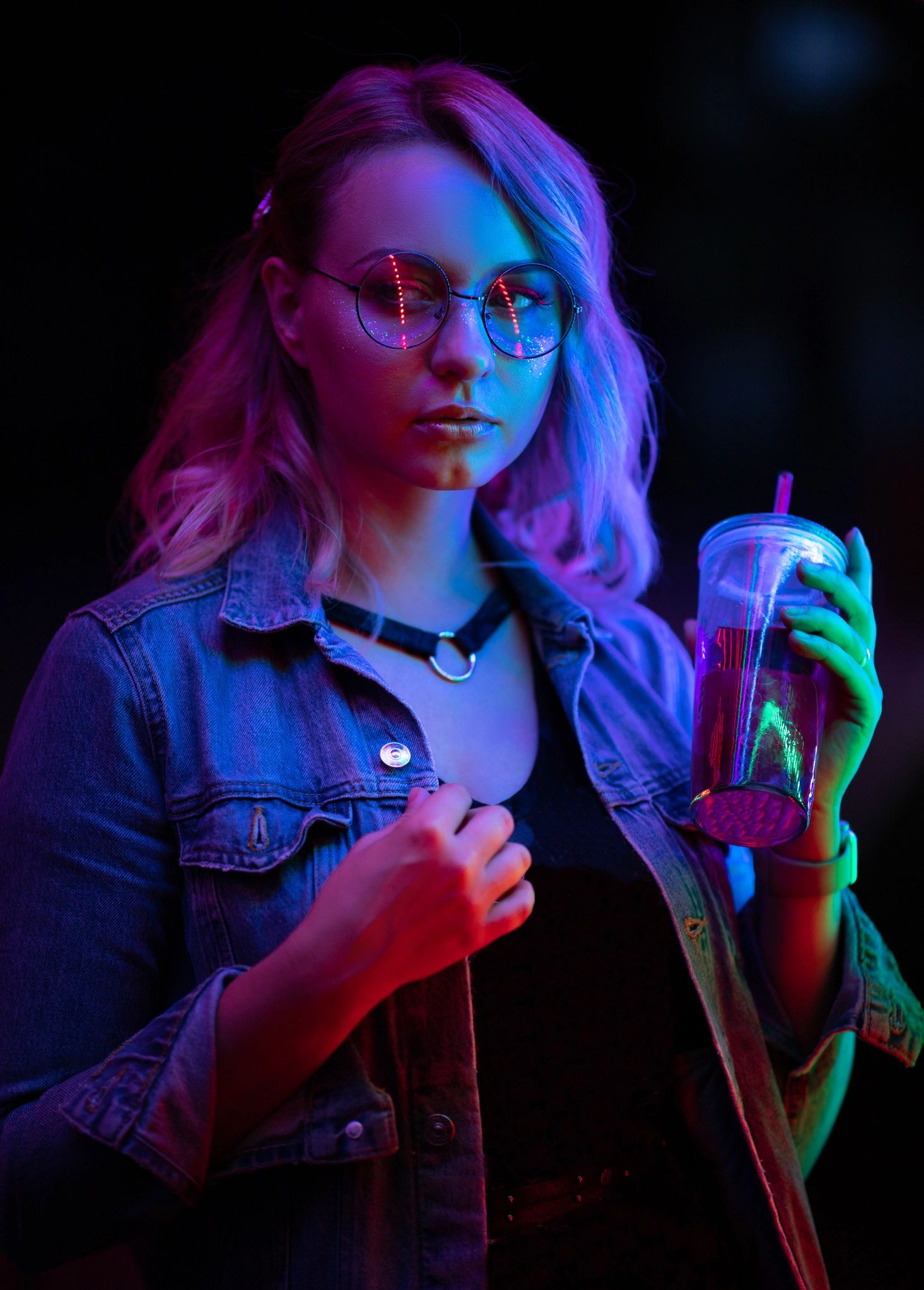 Woman under colorful neon lights