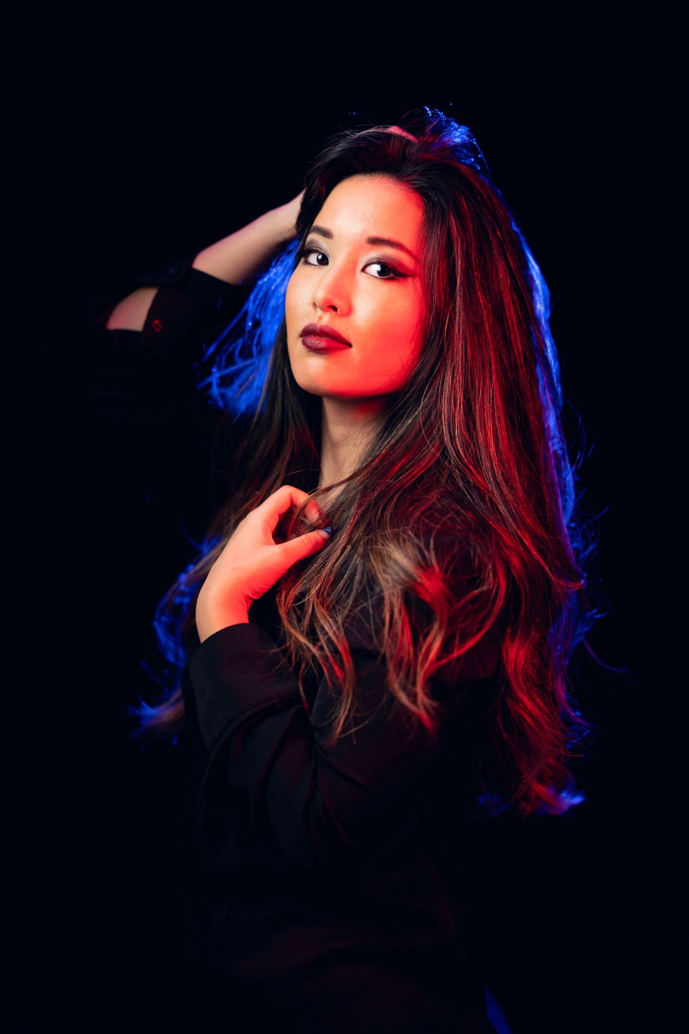 Profile portrait lit by neon colors for an artistic editorial look